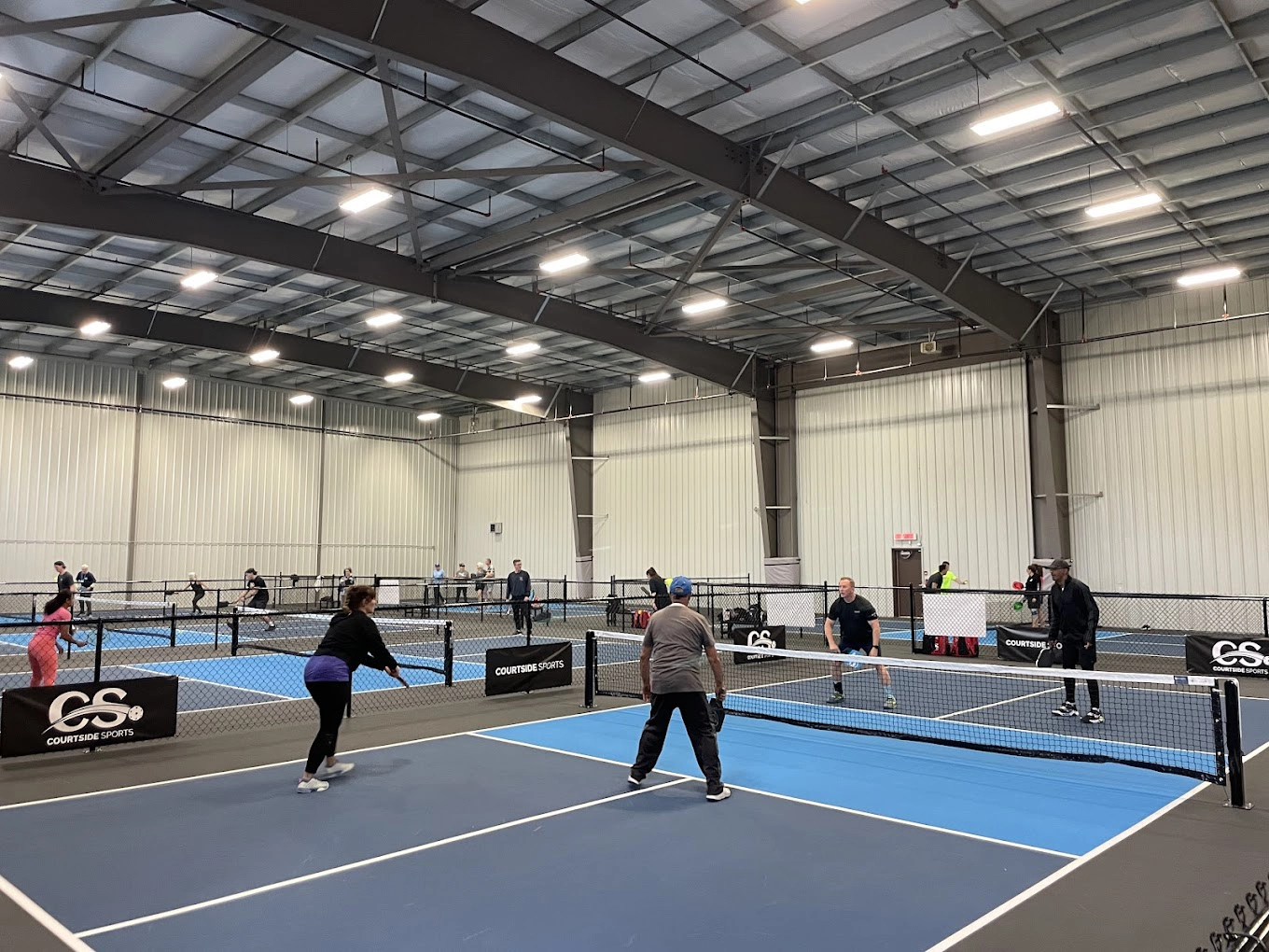Blue indoor pickleball courts at Victoria Pickleball Centre